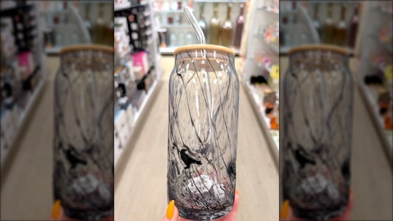 iced coffee tumbler with black crow and wooden top and straw