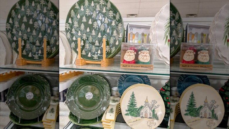 Ceramic plates with evergreen tree designs and one with a Church painted on it