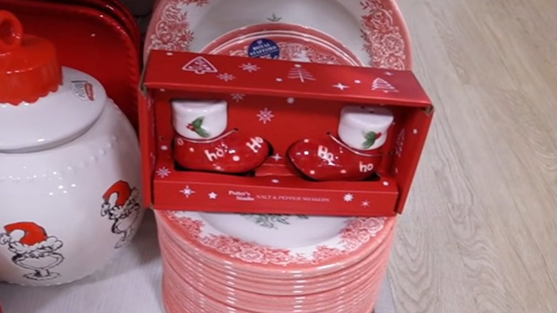 A salt and pepper set shaped like red Christmas stockings with white rims