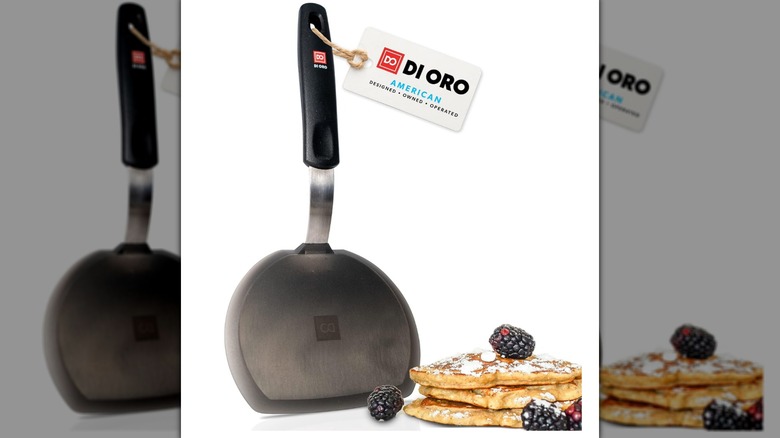 A DI ORO Silicone Pancake Turner and a stack of pancakes with blackberries on a white background