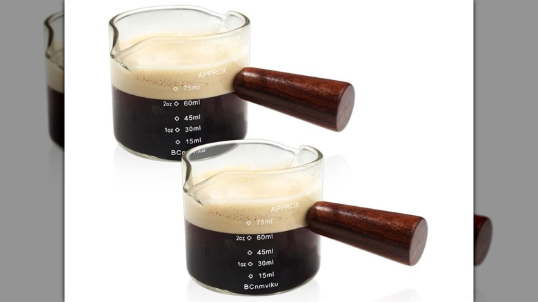 Two Double Spout Measuring Espresso Cups on a white background