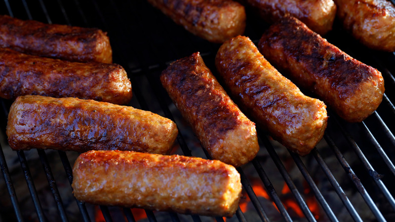 Cevapi sausages being grilled