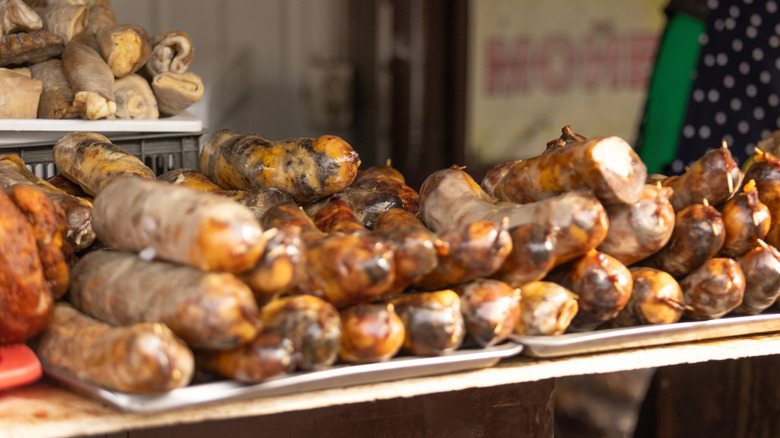 Traditional kazy sausages laid out for sale in a market