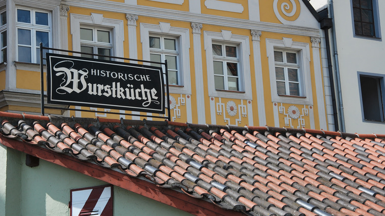 Wurstkuchl sign on historic building