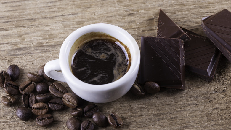 Espresso cup with chocolate and coffee beans