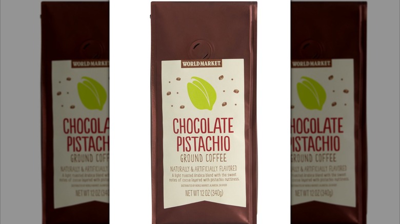 Chocolate pistachio ground coffee on white background