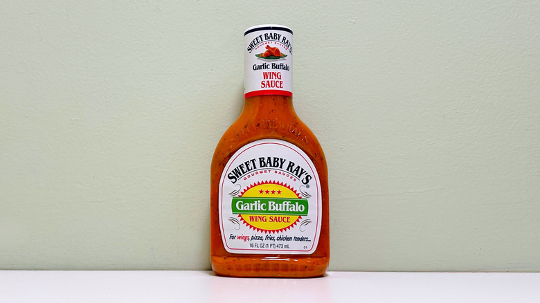 A bottle of Sweet Baby Ray's Garlic Buffalo Wing Sauce