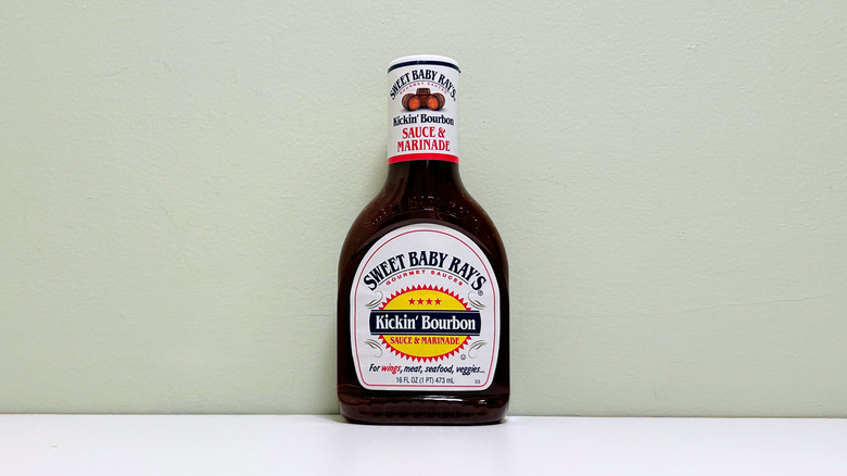 A bottle of Sweet Baby Ray's Kickin' Bourbon Sauce