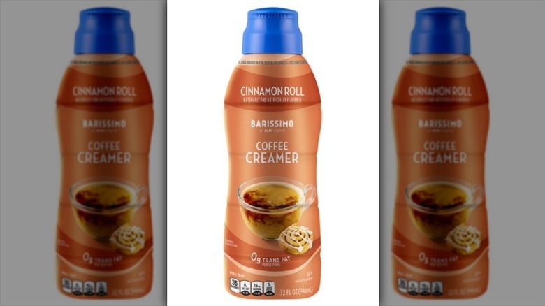 Barissimo cinnamon roll creamer in a brown bottle with a blue lid on white background
