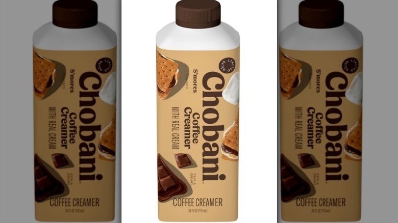 Chobani s'mores creamer in a tan, white bottle with s'mores pictures on it and a brown cap on white background