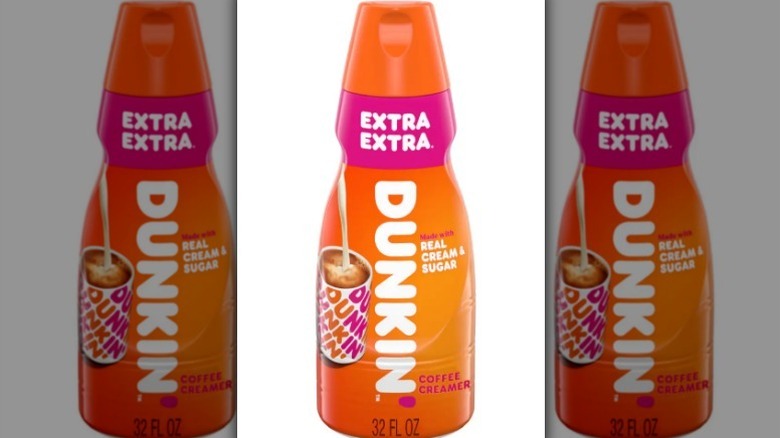 Dunkin' Extra Extra creamer in an orange and pink bottle on white background