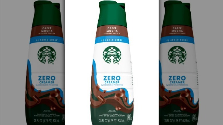Starbucks mocha zero sugar creamer in a green, brown, white, and blue bottle on white background