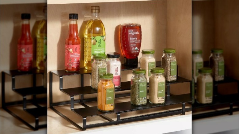 Cooking items sitting on expandable spice rack