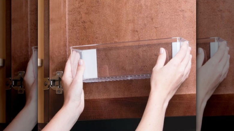 Hands mounting adhesive organizer bin