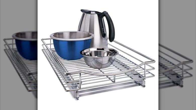 Cabinet organizer with kitchen items on white background