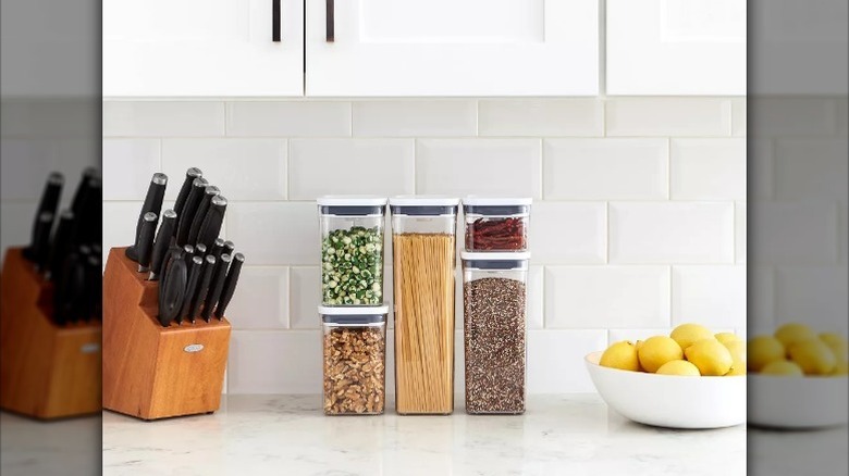 Oxo storage bins sit on kitchen counter