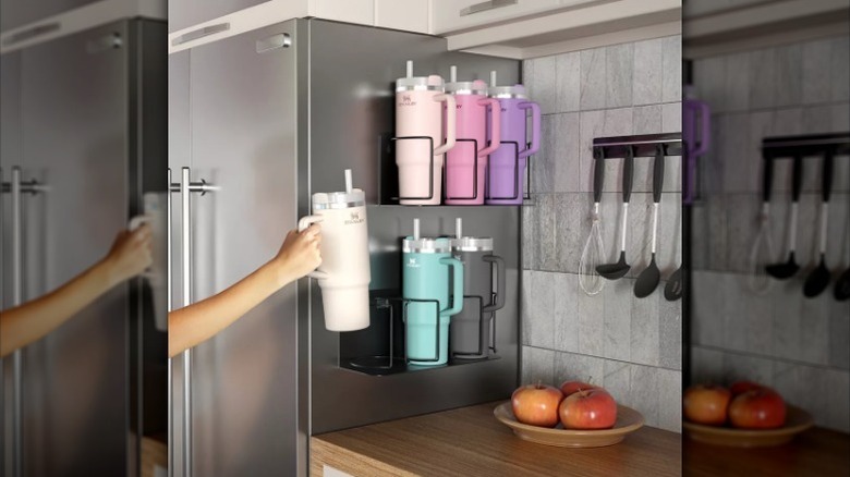 Hand putting water bottle on storage rack