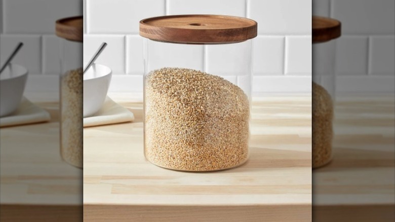 Glass storage canister resting on counter