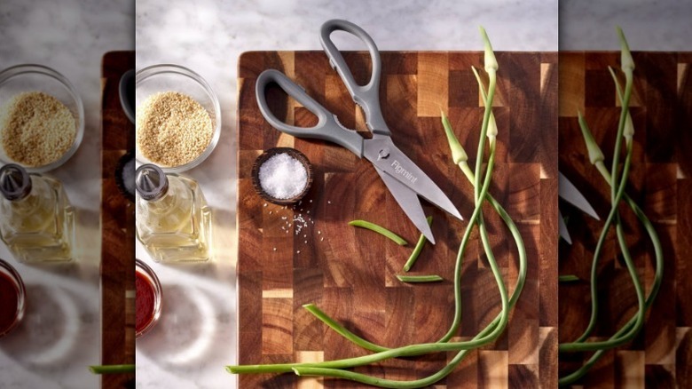 Figment stainless steel kitchen shears on wood board with green onion