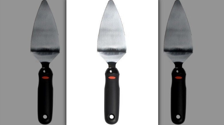 OXO stainless steel pie server on white background