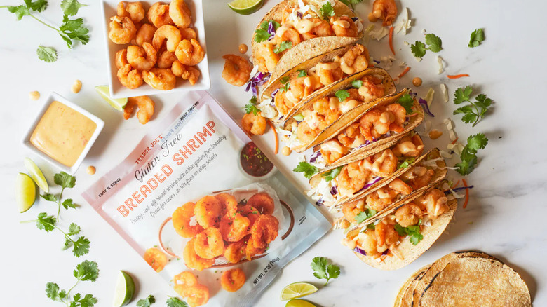 Breaded shrimp on plate with tacos and the breaded shrimp package nearby