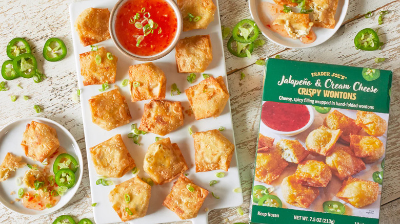 Jalapeño cream cheese wontons on platter with box