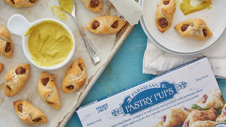 Parmesan pastry pups on baking sheet with box nearby