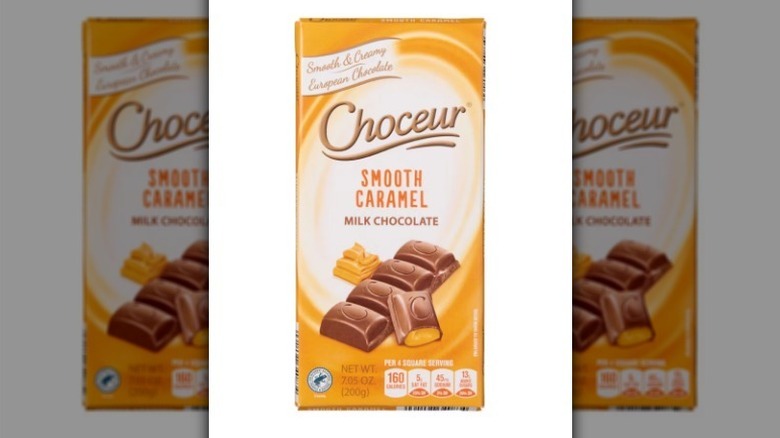 Caramel milk chocolate bar on white background