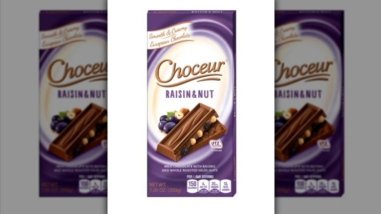 Raisin and nut chocolate bar on white background