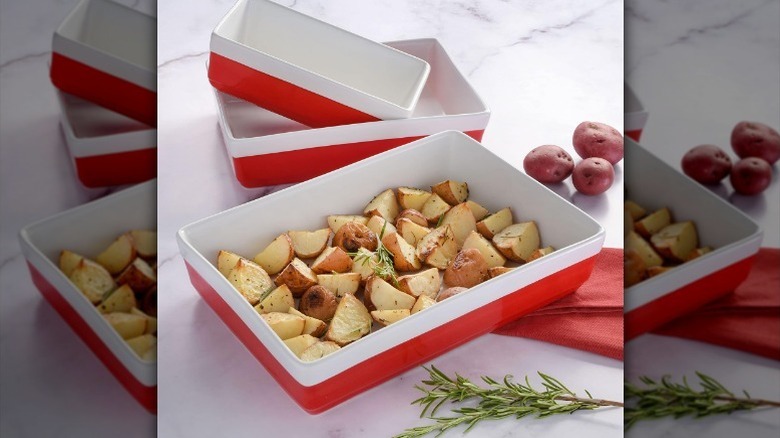 3 piece bakeware set filled with red potato wedges on counter