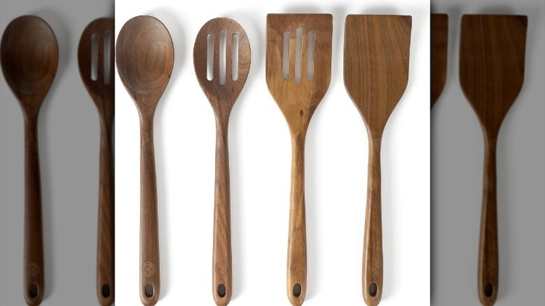 4-piece wood cooking utensil set on white background