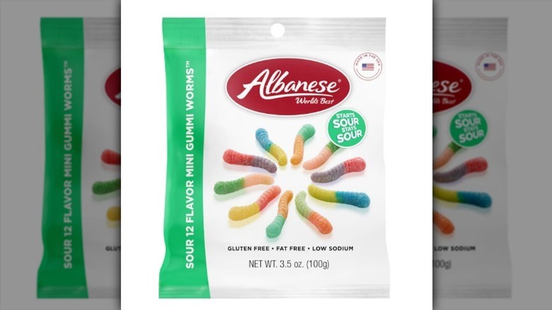 Sour gummy worms on white background