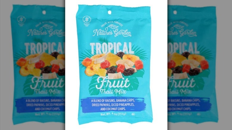 Tropical fruit trail mix on white background