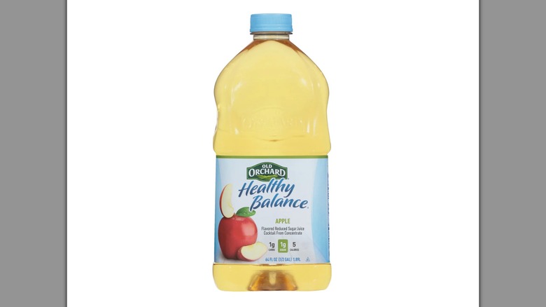 Old Orchard Reduced Sugar Apple Juice on a white background
