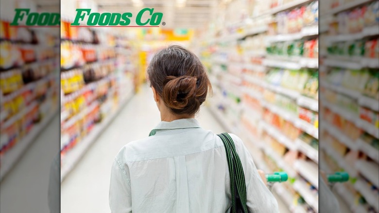Woman in Foods Co grocery store shopping