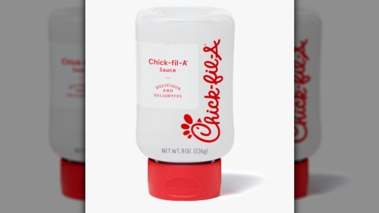 Chick-Fil-A sauce with red text and lid on white background