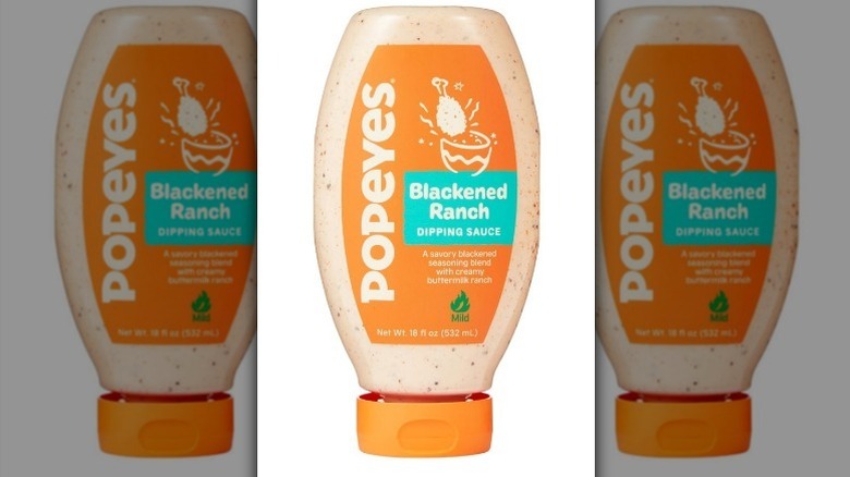 Popeyes blackened ranch sauce with an orange and aqua label on white background