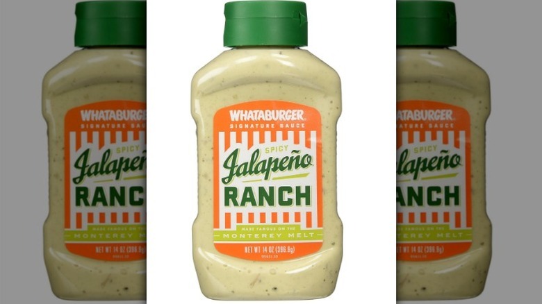 Whataburger spicy jalapeno ranch with an orange, white, and green label on white background