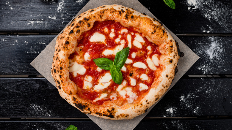 pizza and stone on table