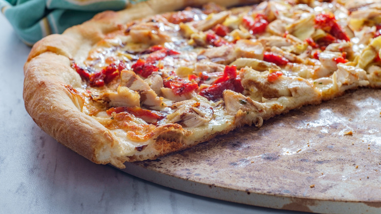 sliced pizza on stone