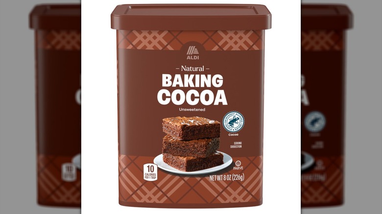 A container of Aldi Baking Cocoa on a white background