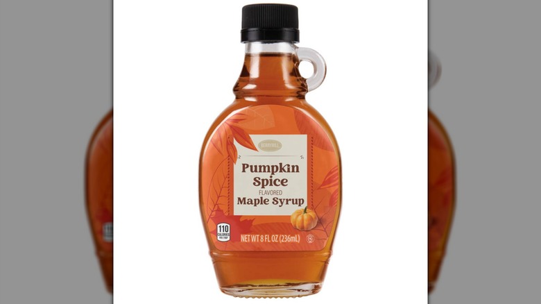 A bottle of Specially Selected Pumpkin Spice Maple Syrup on a white background