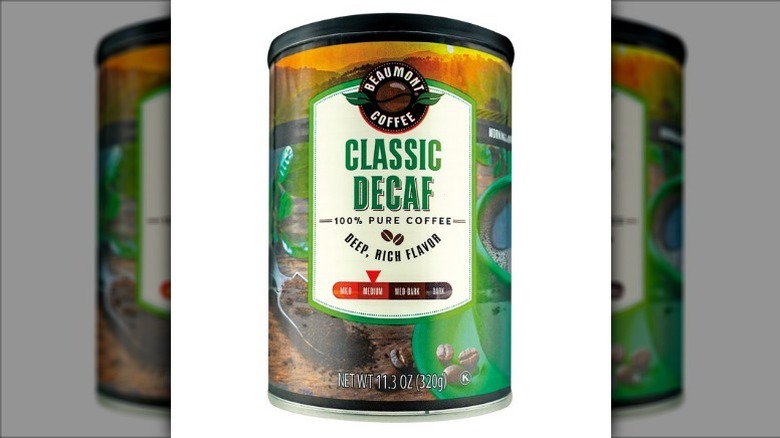 Classic decaf coffee in a canister on a white background.