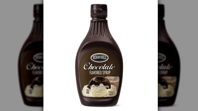 Berryhill chocolate syrup in a brown plastic bottle on white background.