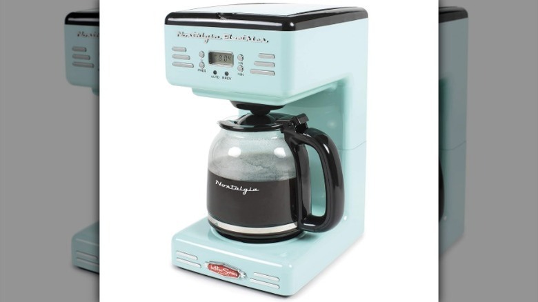 Light blue Nostalgia drip coffee maker against white background.