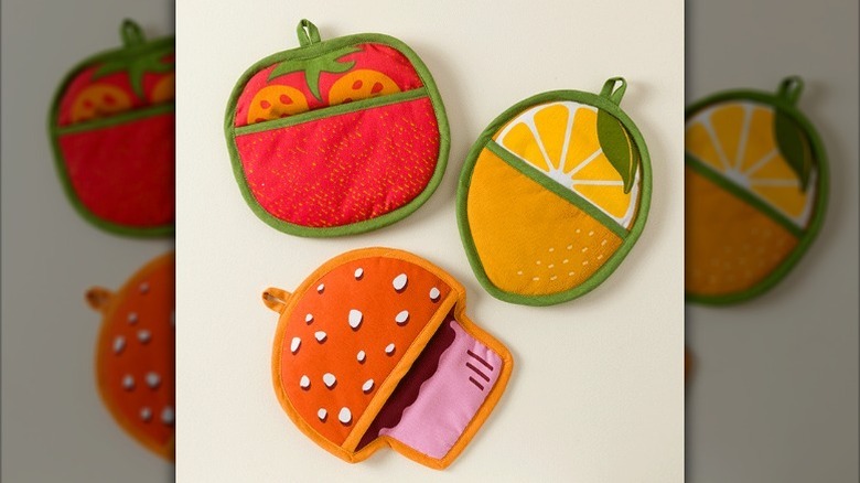 Fruit and veggie pot holder options on white counter
