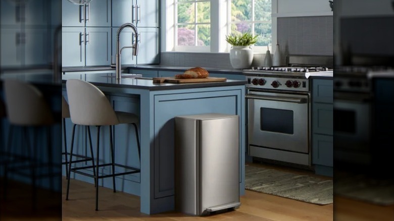 Kohler trash can next to kitchen island