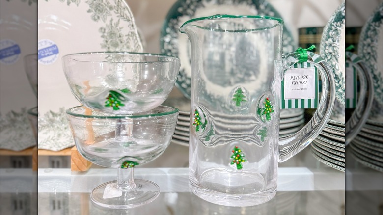 Glass Christmas tree pitcher and glasses on a HomeGoods shelf