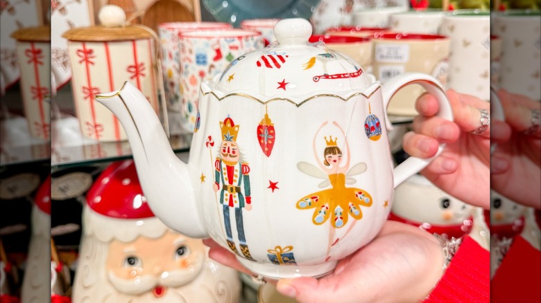 Person holding the Nutcracker ballet teapot