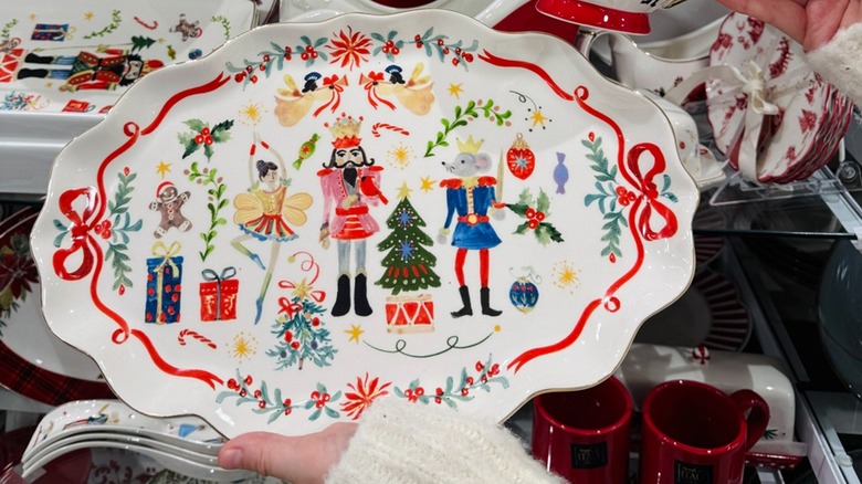 Person holding the nutcracker serving platter